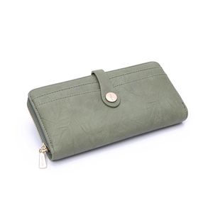 Detail of green long wallet showing lychee grain PU leather texture and gold hardware zipper