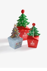 Three-size Christmas gift boxes with 3D paper tree toppers and festive deer patterns