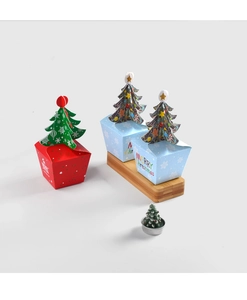 Detail of Christmas candy boxes with 3D tree closure and festive snowflake prints