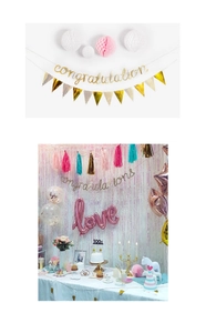 Detailed set of gold and pink party decorations featuring glitter banners and balloons