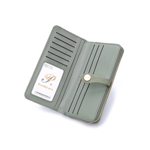 Detail view of sage green long wallet with multiple card slots and clear ID window