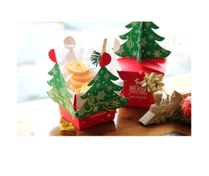 Detail of Christmas gift box with 3D tree design and Merry Christmas greeting