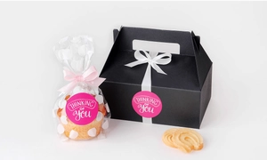 Close-up of thinking of you stickers on gift boxes and cupcake packaging bags