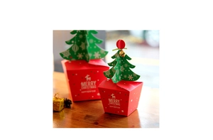 Detail of Christmas gift boxes with 3D tree closure and white reindeer print on red paper