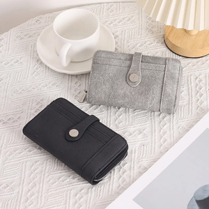 Close-up of fabric texture wallets with multi-card slots and snap closure