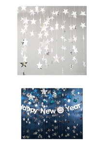 Detail of silver and blue star garland with Happy New Year banner for party decor