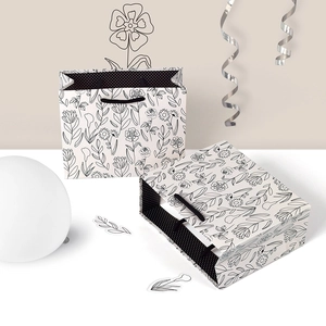 Minimalist grey square gift bag with black floral sketches and polka dot lining
