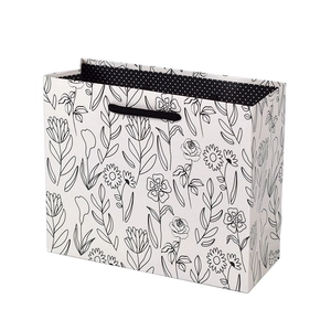 Gray square floral gift bag with black line art patterns and polka dot lining