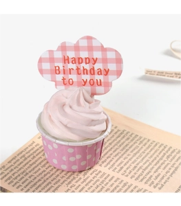 Detail of pink plaid cloud cupcake topper with Happy Birthday text on a muffin
