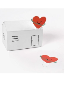 Detail of red heart-shaped cupcake toppers with smiley faces and white paper box packaging