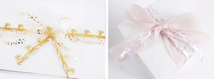 Detailed view of Christmas ribbons with gold reindeer and holographic star patterns