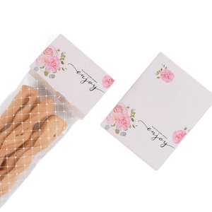 Cute floral food packaging header card with enjoy text and white polka dot bakery bags