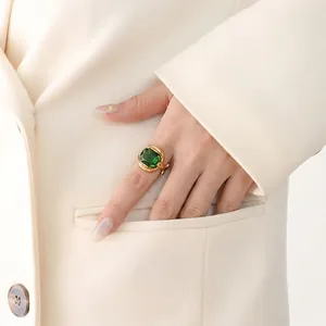 Vintage gold plated stainless steel ring with emerald green crystal on hand