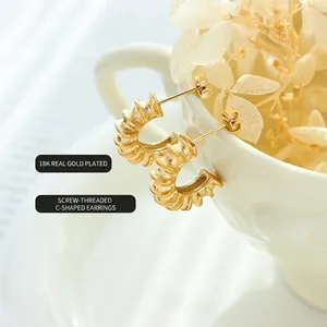 Elegant 18K gold plated spiral C-shaped earrings with textured vintage thread design