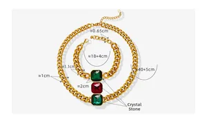 Detail of gold Cuban chain set with square green and red crystals and adjustable clasps