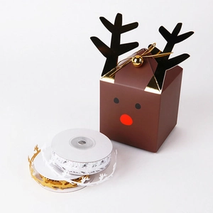 Christmas gift box set with reindeer design and snowflake ribbons on white background