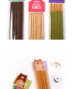 Close-up of cartoon snack packaging cards with assorted chocolate biscuit sticks