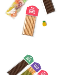 Detail of colorful cartoon food packaging cards with assorted chocolate snack sticks