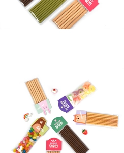 Close-up of cute cartoon animal cards sealing clear treat bags with assorted snack cookies