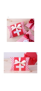 Detail von rot gestreiften Geschenkkartons mit beigem Satinband und 15mm Bandbreite