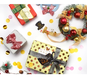 Detailed overhead view of festive Christmas gift wrapping kit with ribbons and bows