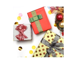 Three festive Christmas gift boxes with assorted glitter ribbons and seasonal pine cones
