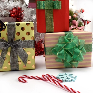 Festive Christmas gift box assortment with colorful bows and seasonal decorations