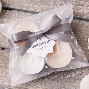 Gray satin ribbon bow on handmade tealight candle gift set with decorative tag