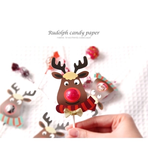 Close-up of reindeer lollipop paper cards made of eco-friendly coated paper with gold bows