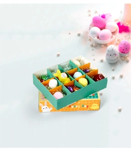 Detailed view of the 12-grid Easter gift box with colorful eggs and cute rabbit illustrations