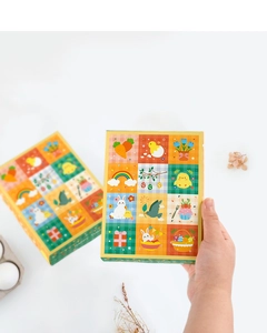 Detail of colorful Easter surprise box with carrot and bunny illustrations for kids