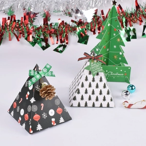Christmas pyramid gift boxes with snowflake patterns and green tree card decorations