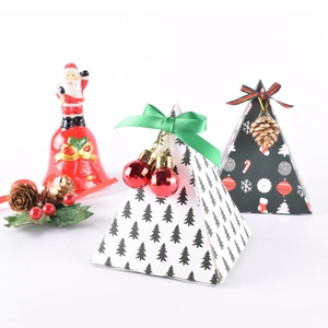 Pyramid-shaped Christmas gift boxes with festive patterns and ribbon decorations