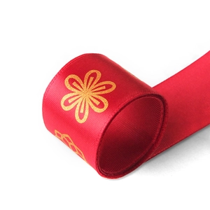 Red satin ribbon with gold floral print for New Year gift box and cake packaging