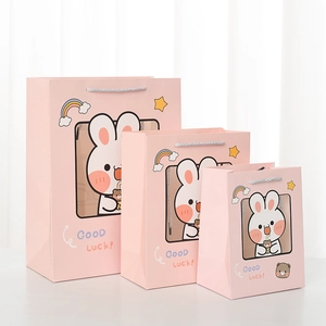 Detailed set of three pink rabbit gift bags in various sizes with Good Luck text
