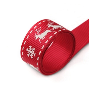 Christmas reindeer patterned red grosgrain ribbon for gift packaging and holiday DIY decor