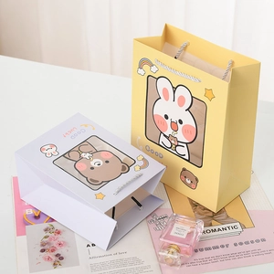 Cute cartoon gift bags with transparent windows and rabbit motifs for kids' presents