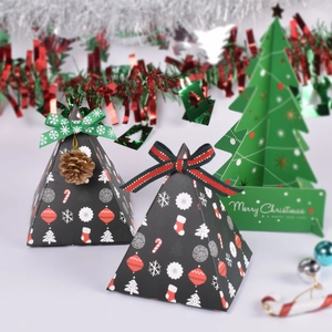Christmas pyramid gift boxes with festive patterns and pine cone charms on ribbons