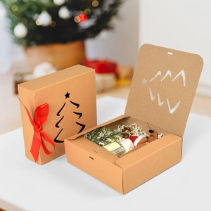 Minimalist square kraft Christmas gift box with red ribbon and tree cutout detail