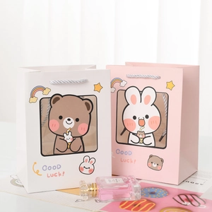 Cute cartoon paper gift bags with bear and rabbit prints for Children's Day celebration