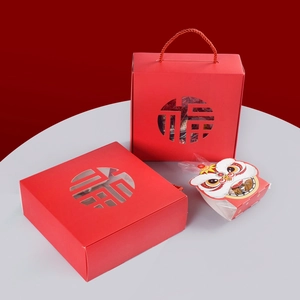 Chinese New Year festive red gift boxes with Fu character cutout and lion design