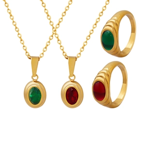 Vintage gold-plated Egyptian style set with red and green gemstones on rings and necklaces
