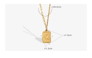 Detailed view of vintage gold plated necklace with butterfly pendant and mixed link chain