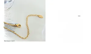 Detail of gold-plated butterfly necklace showing lobster clasp and adjustable extension chain