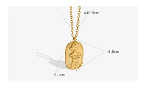 Macro shot of gold oval pendant with 3D embossed figure on 40+5cm adjustable chain