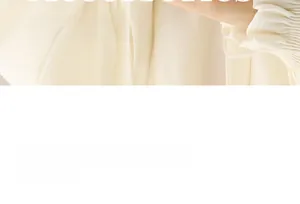 Detail of cream long sleeve cuff with elastic pleats and natural fabric texture