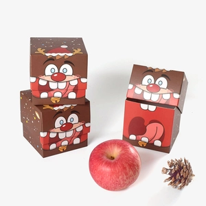 Trois boîtes cadeaux de Noël avec motifs renne et Père Noël pour emballage de pommes