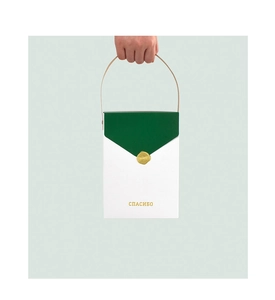 Boîte cadeau minimaliste blanc et vert avec sceau de cire et texte de merci russe