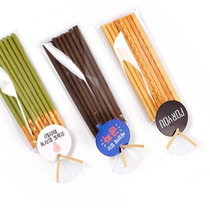 Three-pack of biscuit sticks in clear OPP bags with decorative cards and twist ties
