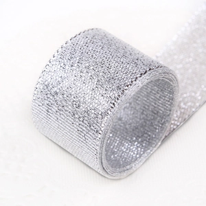 Roll of 25mm silver glitter metallic ribbon for gift wrapping and DIY crafts
